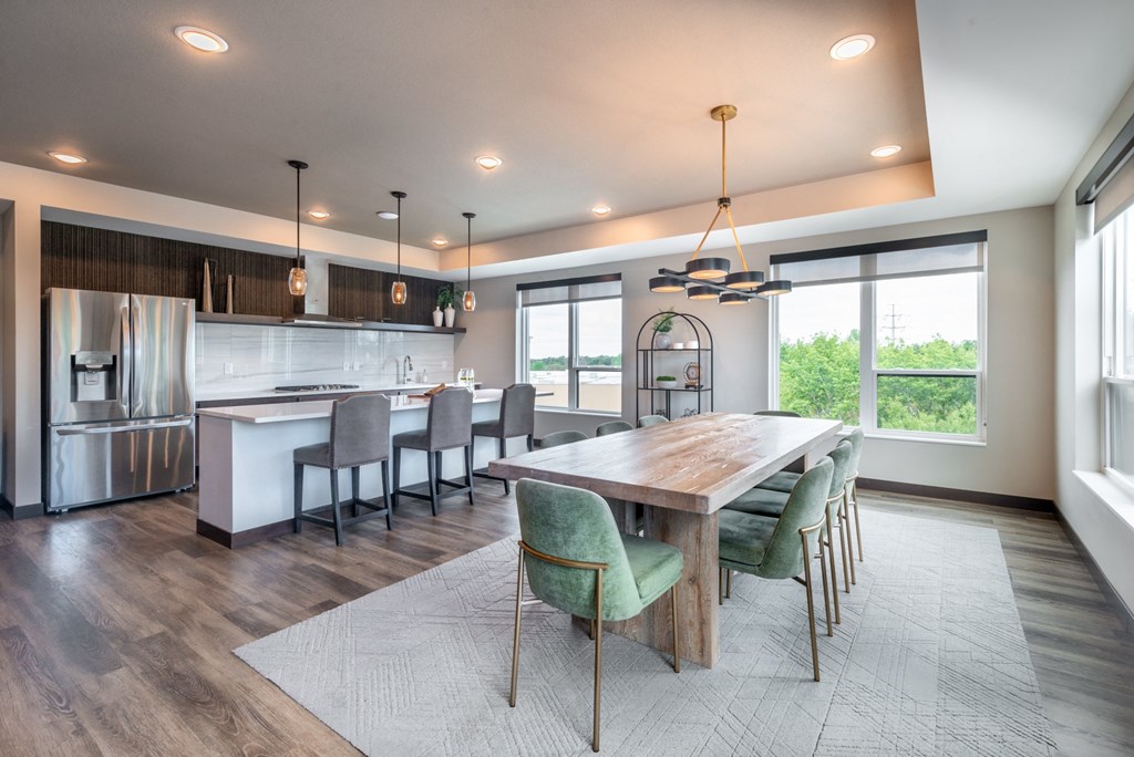 a large kitchen and dining room with a large table and chairs
