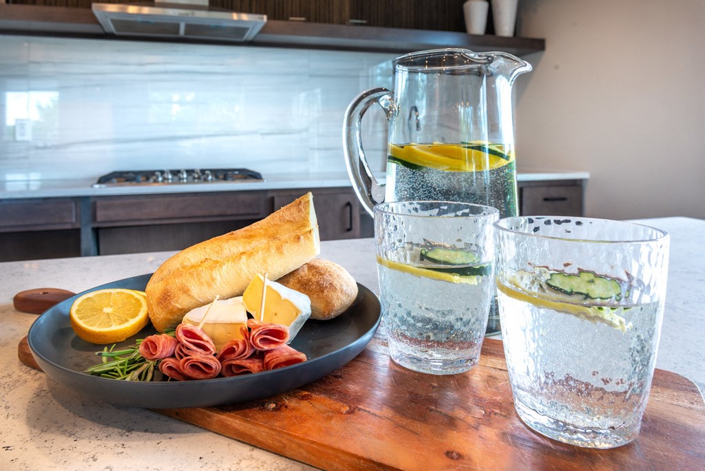 a plate of food and a glass of water on a table