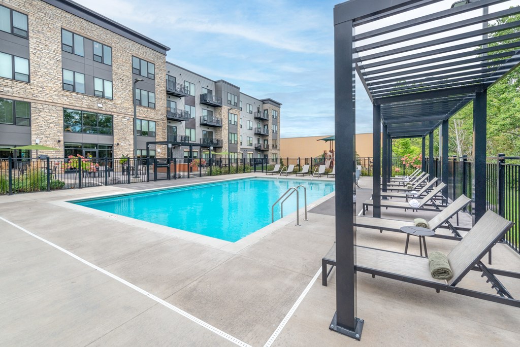 our apartments offer a swimming pool with chaise lounge chairs