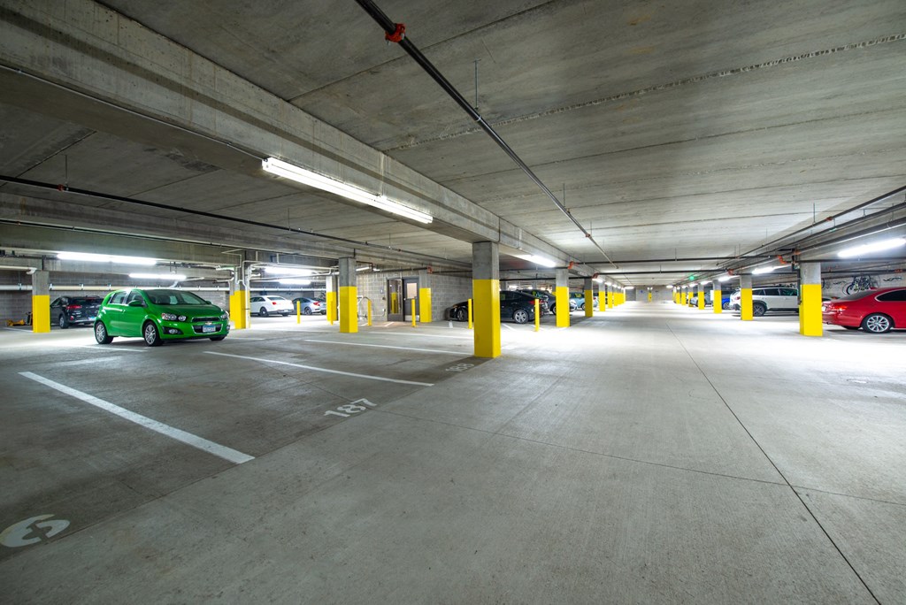a parking garage with cars parked in it