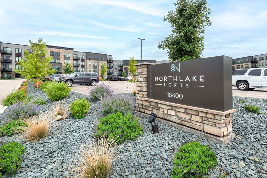 the enclave at northlake apartments sign in front of parking lot