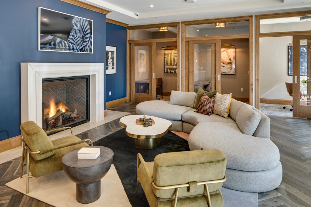 a living room with blue walls and a fireplace