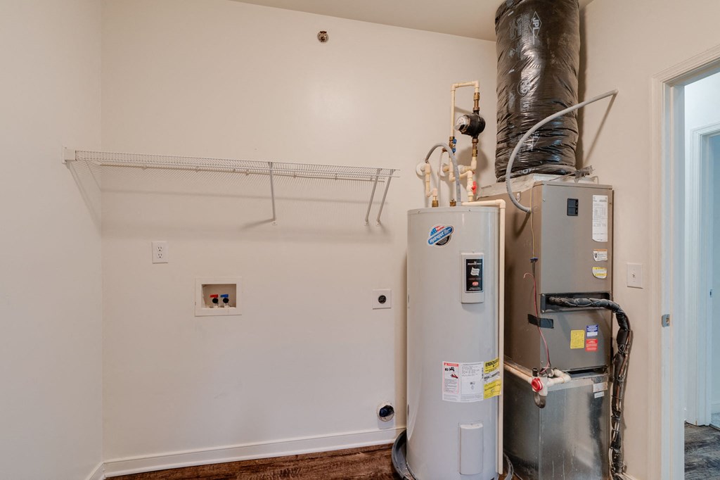 boiler and refrigerator in the corner of a room