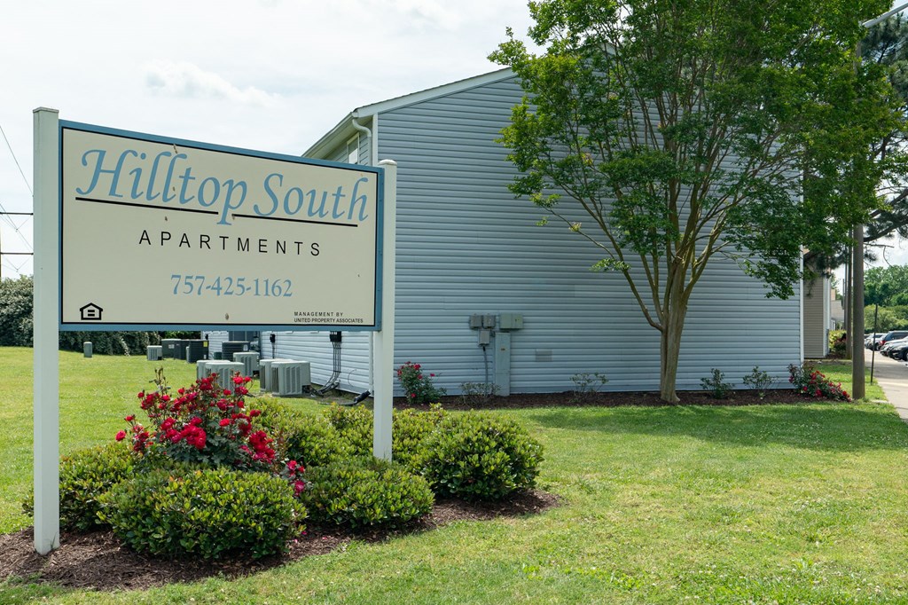 the building where the apartments are located has a sign