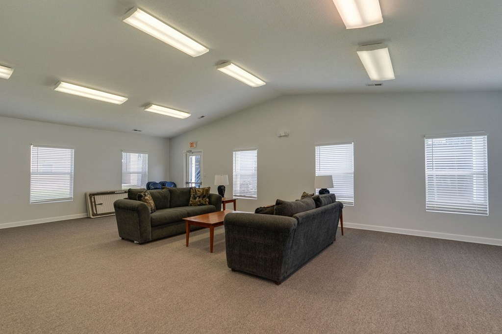 a living room with couches and a coffee table