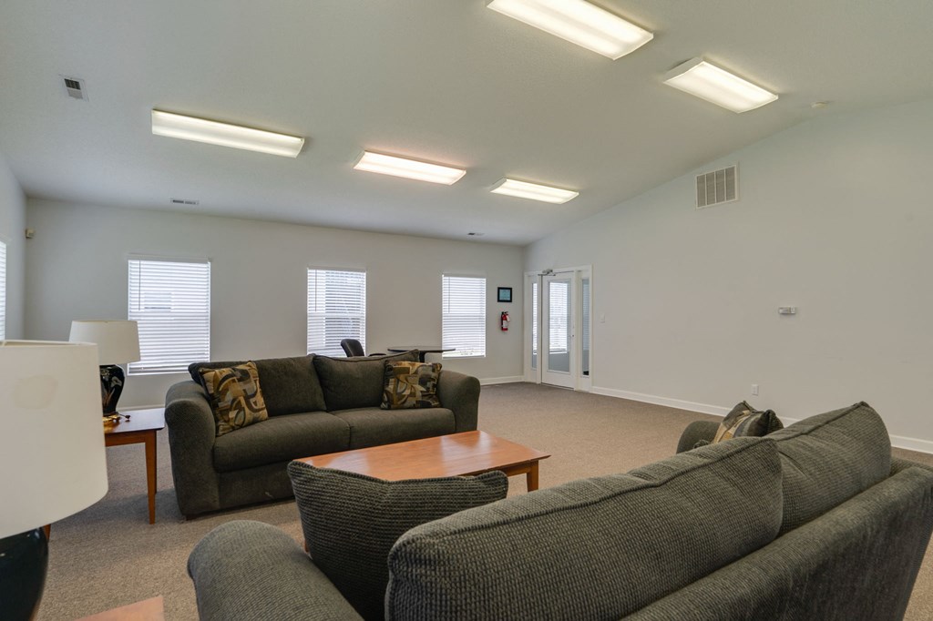 a living room with couches and a coffee table