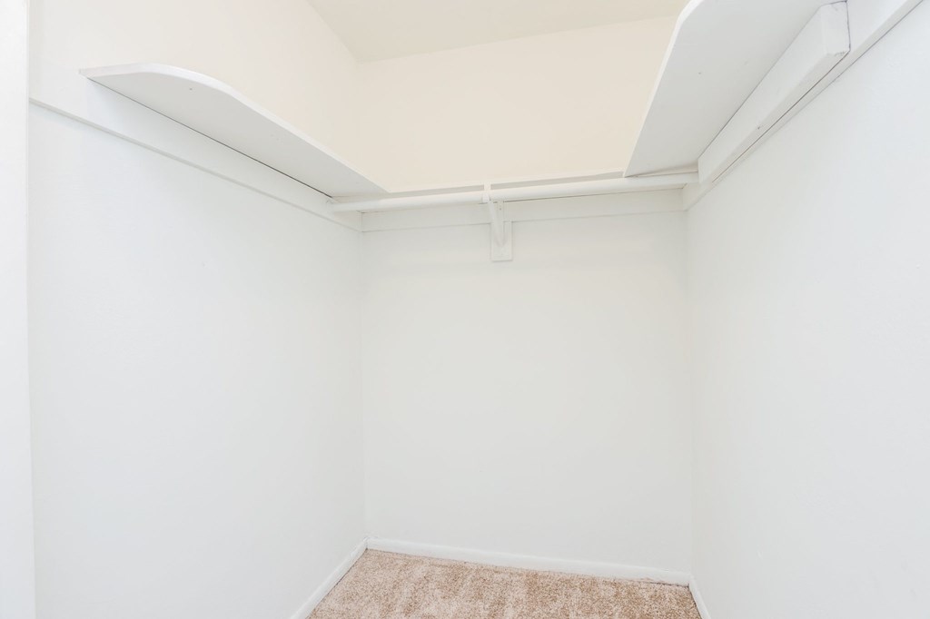 an empty room with white walls and a white ceiling