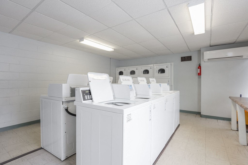 the laundry room is equipped with washers and dryers
