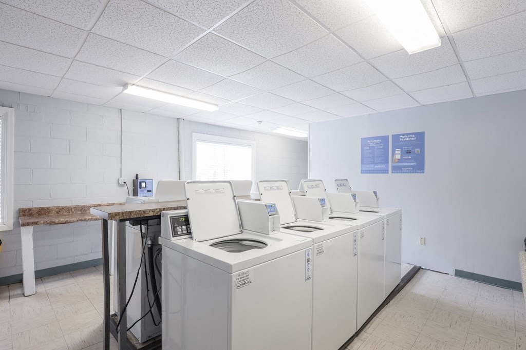 the laundry room is equipped with washers and dryers