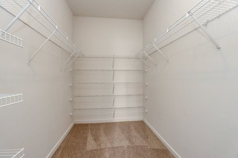 the preserve at ballantyne commons empty walk in closet with white shelves
