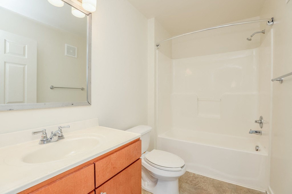 a bathroom with a sink toilet and a shower