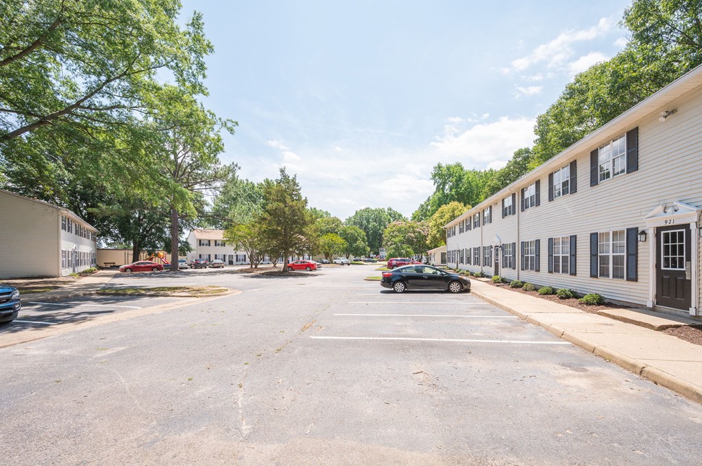 a parking lot with a car parked in front of a building