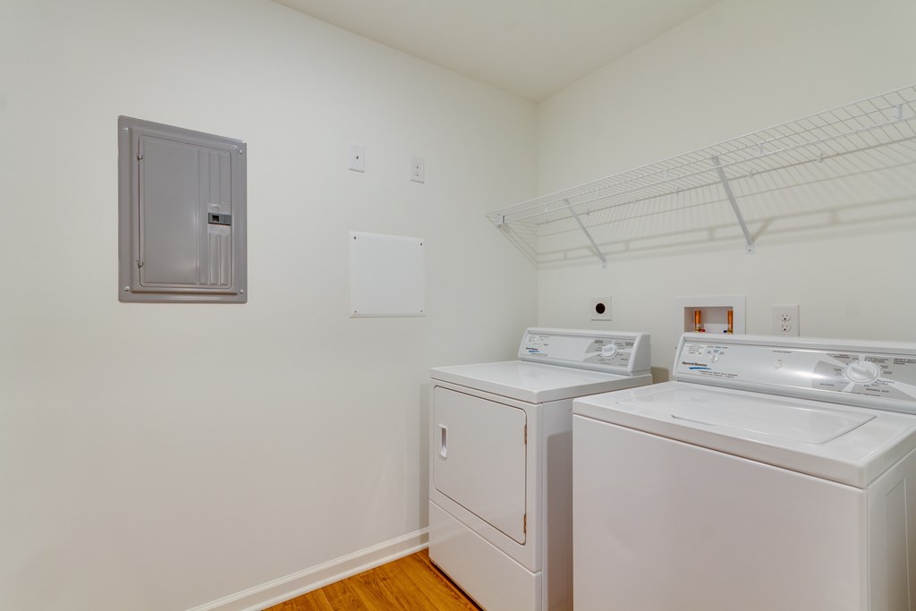 A laundry room with a washer and dryer.