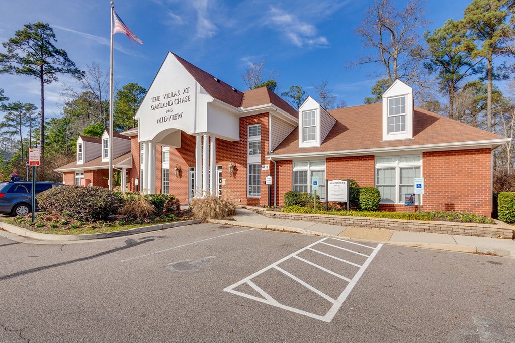 The Villas at Midview Apartments is a brick building with a parking lot in front.