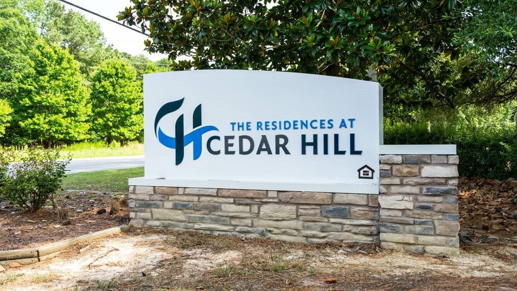 a sign at the residences at cedar hill