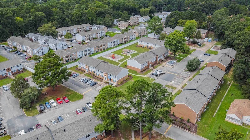 an aerial view of a neighborhood with houses and trees