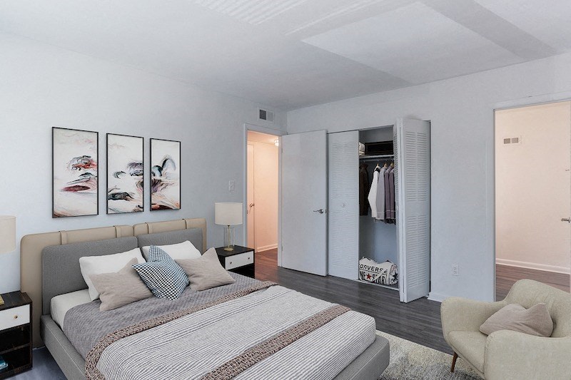 a bedroom with a bed and a closet