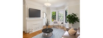 a living room with a fireplace and a tv on the wall