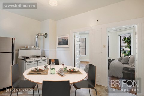 a renovated kitchen and dining room with a table and chairs