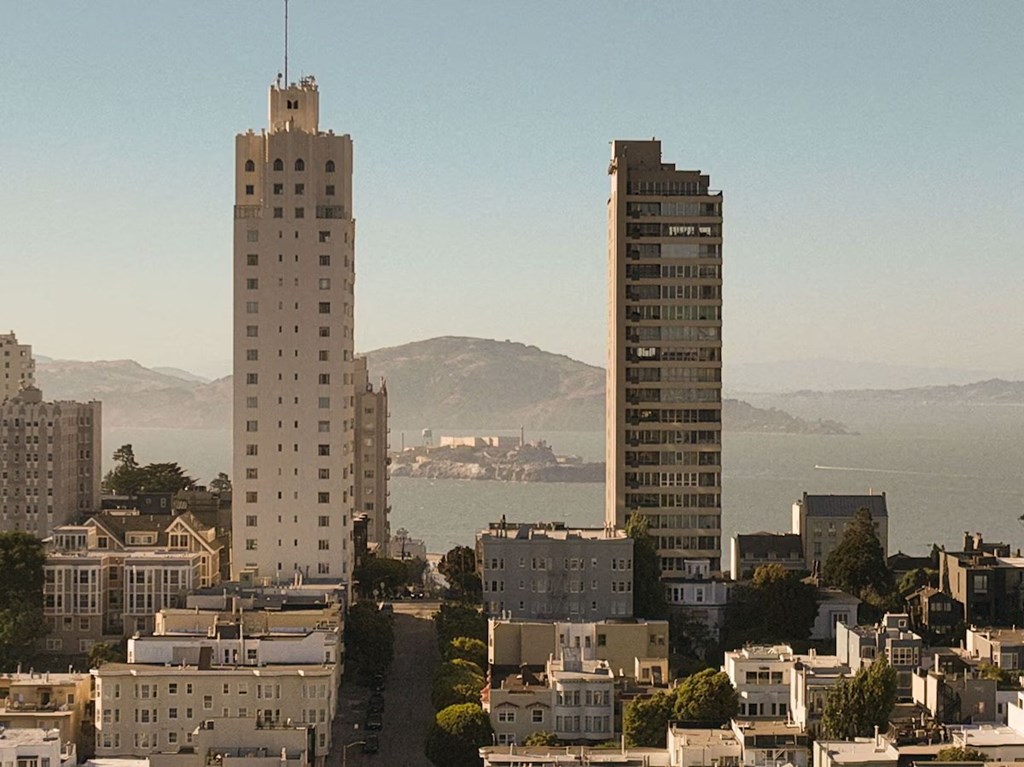 a view of the city with two tall buildings