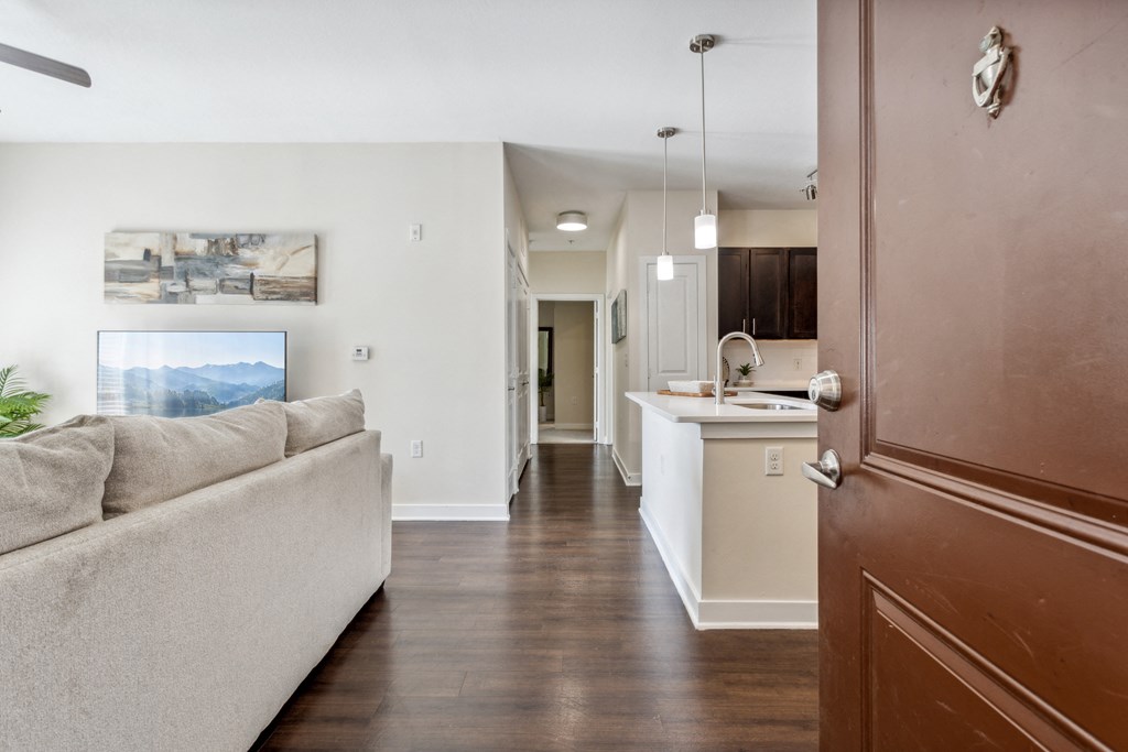 a living room with a couch and a kitchen at Hampton Roads Crossing, Virginia, 23435
