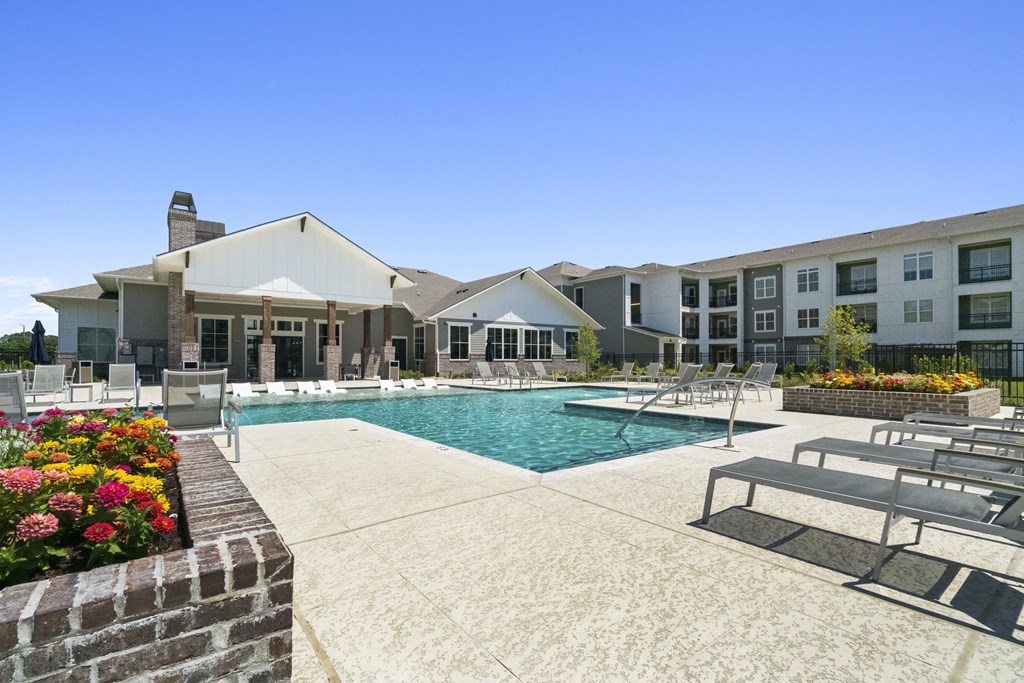 a swimming pool with a building in the background