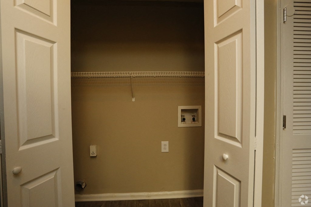 a room with a closet and a door open