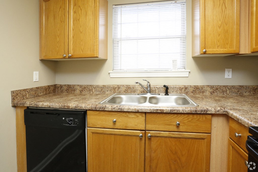 a kitchen with a granite counter top and a sink