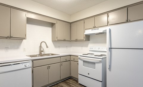 Kitchen With White Cabinetry And Appliances at The Reserve at Wynwood Apartments, Cullman, AL