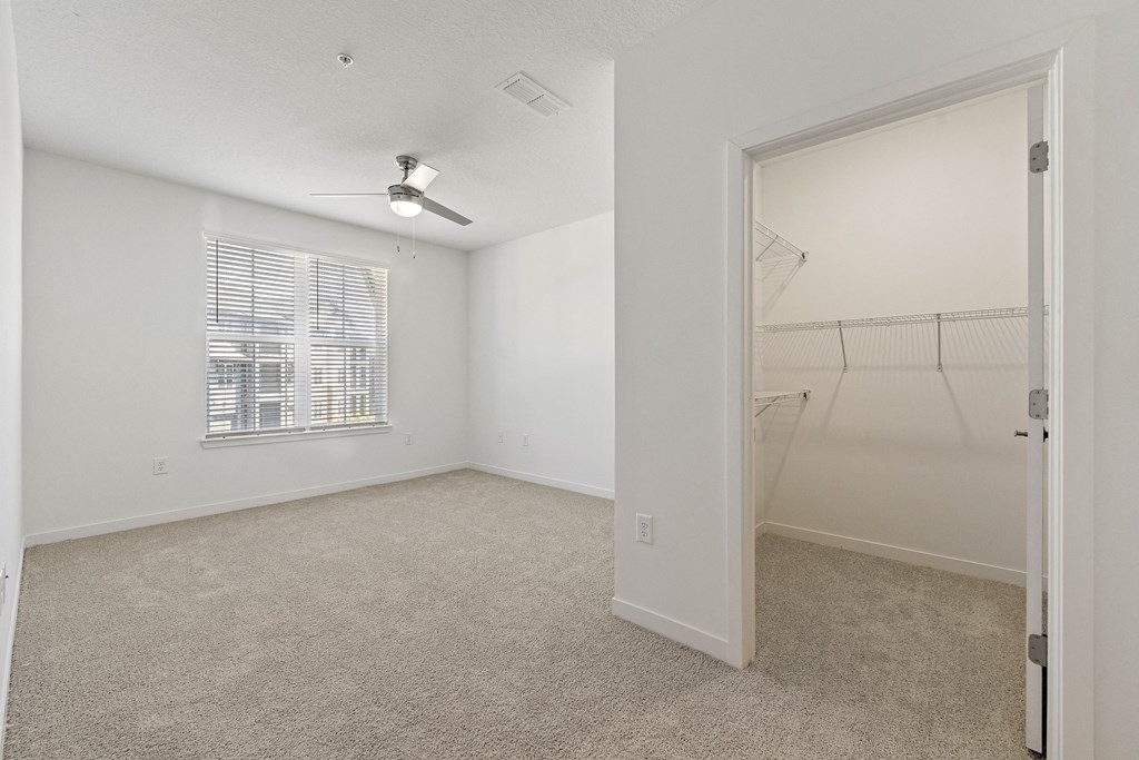 large bedroom with ceiling fan at Tapestry Overbrook in McDonough, Georgia