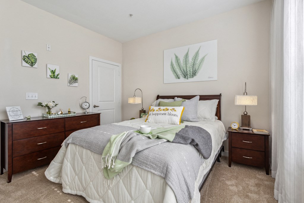 a bedroom with a bed and two dressers a bedroom with a bed and two dressers at Hampton Roads Crossing, Virginia, 23435