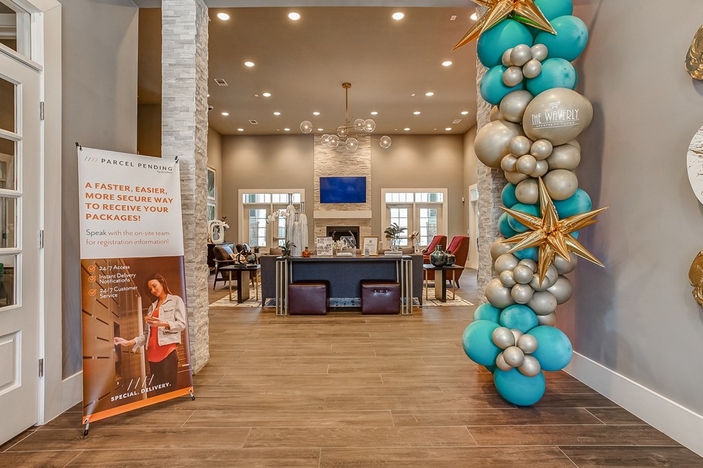a large balloon column in the lobby of a home with a reception desk in the background
