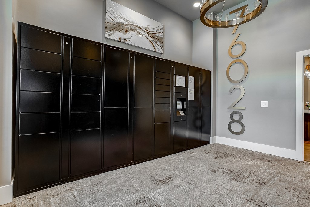 a modern and funky half bathroom reveal with black and white tile in a modern laundry room