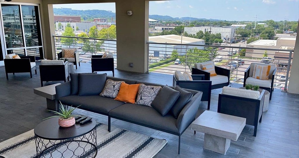 Rooftop entertainment area with electric grills at Flats on 4th Apartments in Birmingham, AL