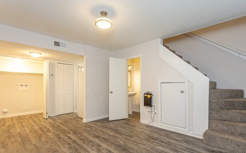 Living Room With Stairs at The Reserve at Wynwood Apartments, Cullman, AL