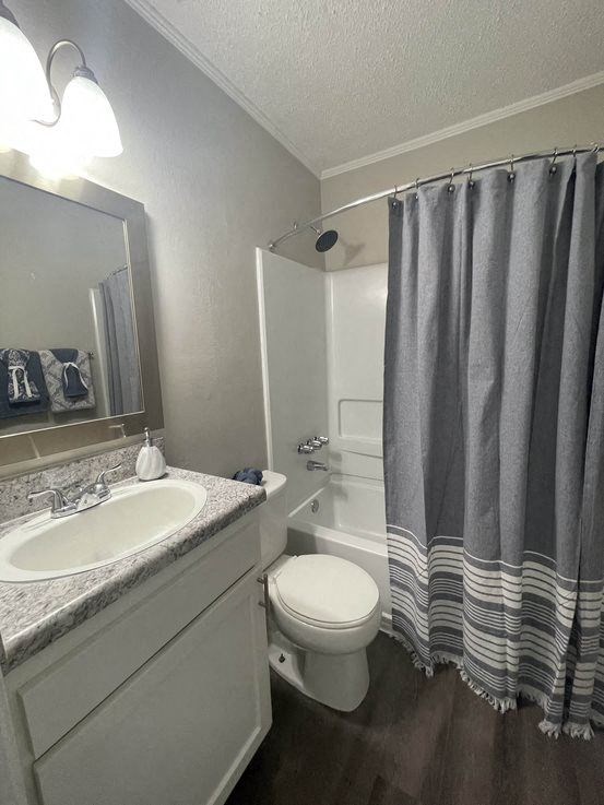 updated bathrooms with wood floors at Midtown Oaks Townhomes in Mobile, AL