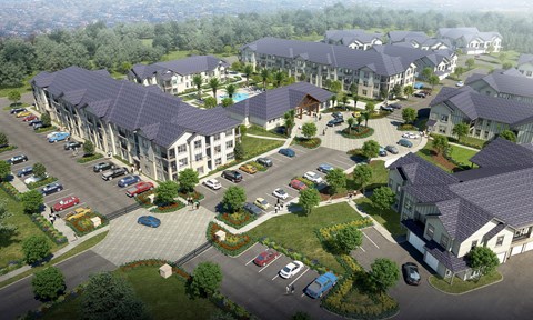 an aerial view of a neighborhood with houses and cars on a street