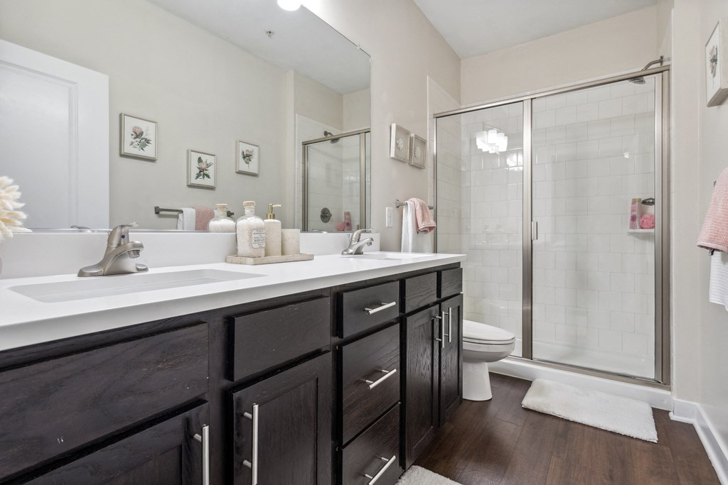 a bathroom with a sink and a shower and a toilet at Hampton Roads Crossing, Virginia, 23435