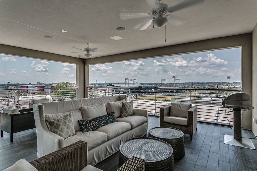 Open air rooftop lounge with view stadium view at Flats on 4th Apartments in Birmingham, AL Rooftop entertainment area with electric grills at Flats on 4th Apartments in Birmingham, AL - Photo Gallery