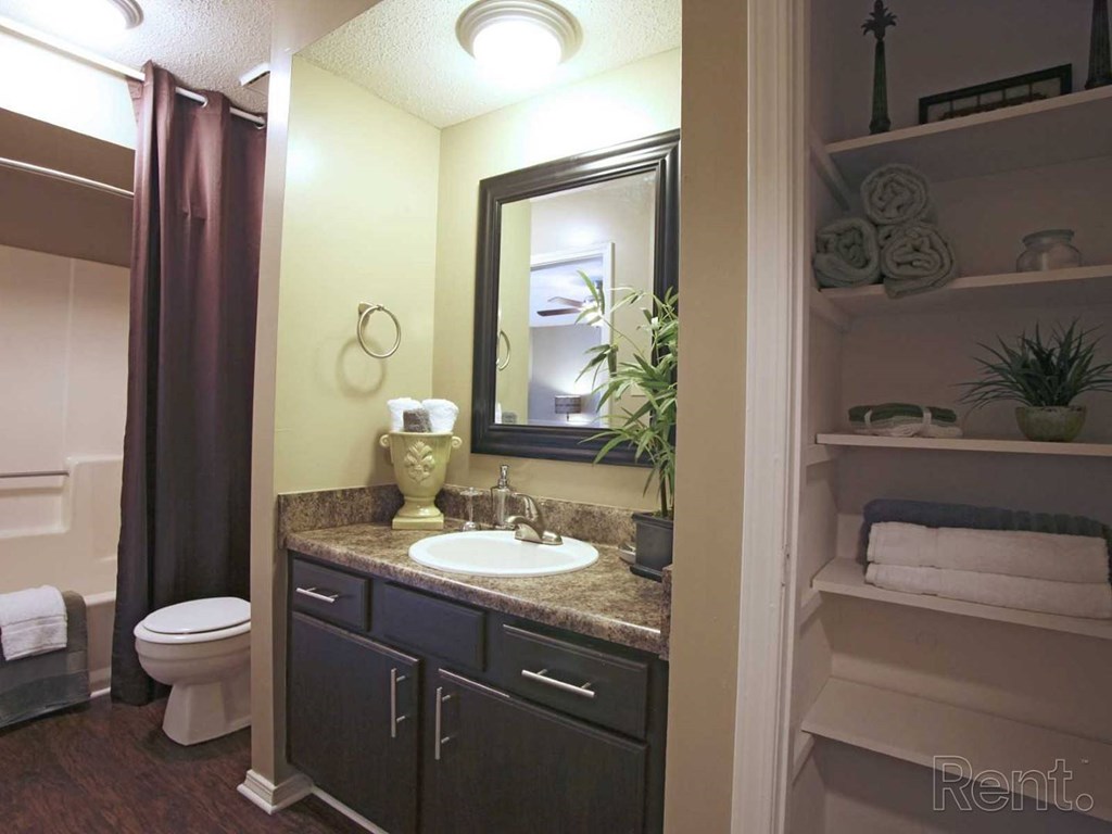 en-suite bathroom with linen closet at The Oakley at Hillcrest in Mobile, AL