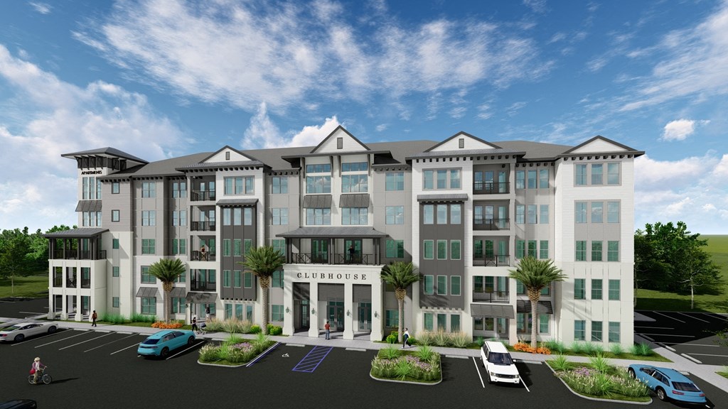 a rendering of an apartment building with cars parked in front of it