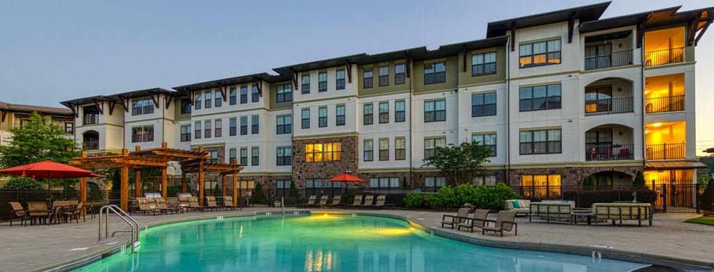 Resort-style Pool with seating at 4700 Colonnade Apartments in Birmingham, AL