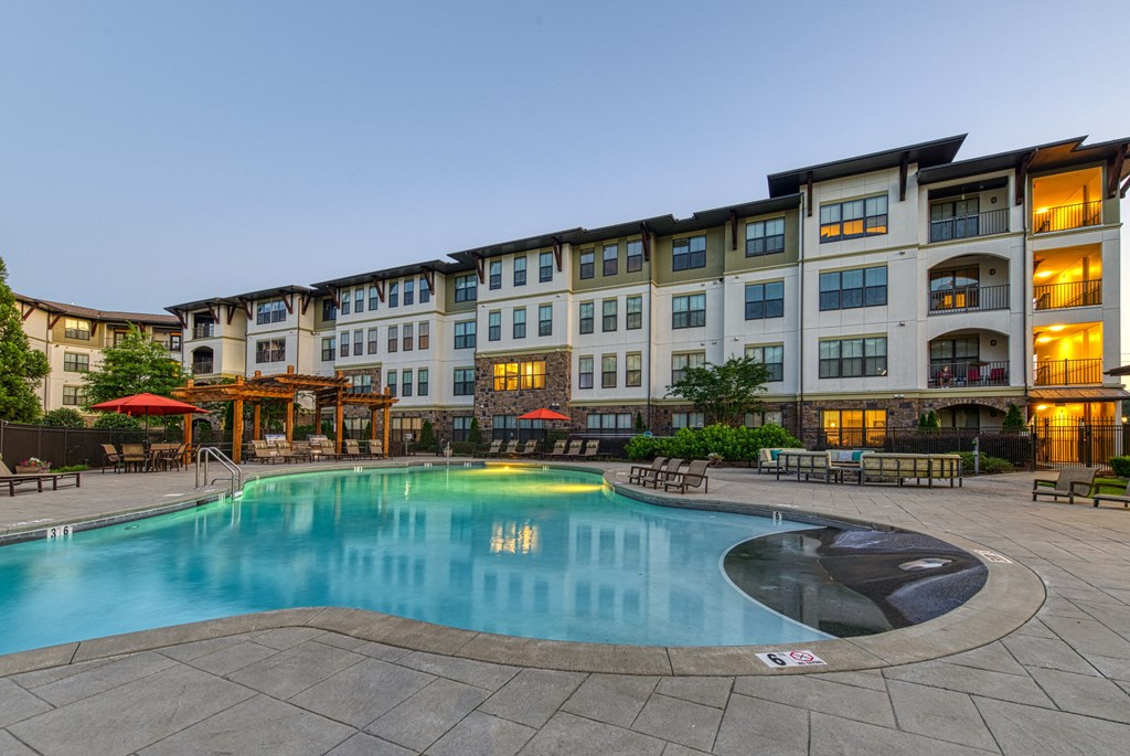Resort-style Pool with seating at 4700 Colonnade Apartments in Birmingham, AL