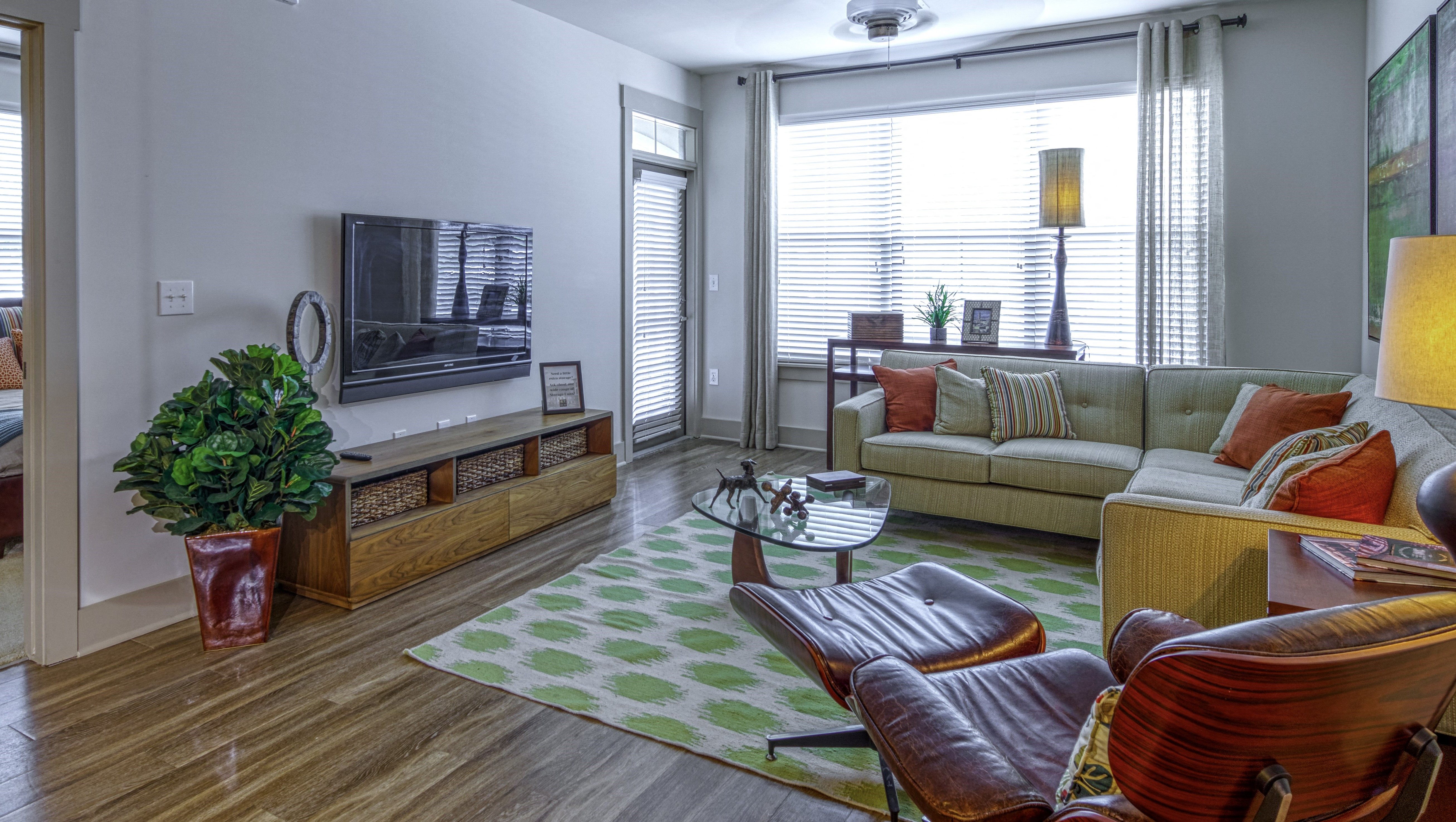 Living Room with Private Patio Access at 4700 Colonnade Apartments in Birmingham, AL