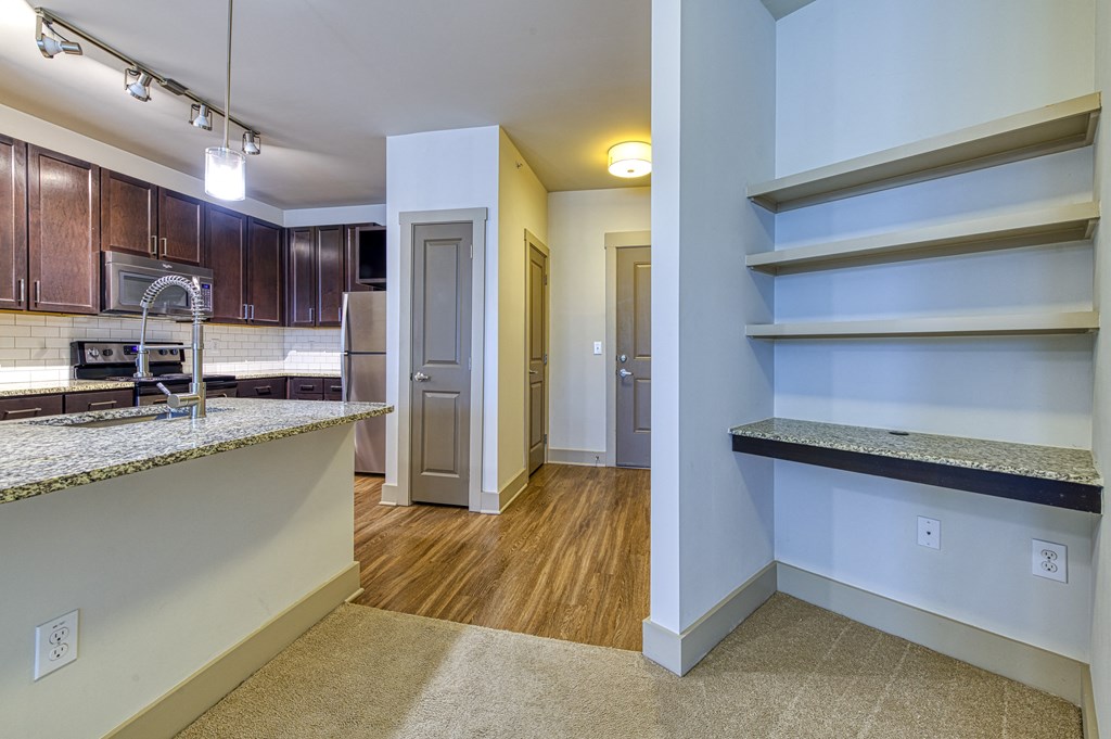 Wood-look floors and ample storage in kitchen at 4700 Colonnade Apartments in Birmingham, AL