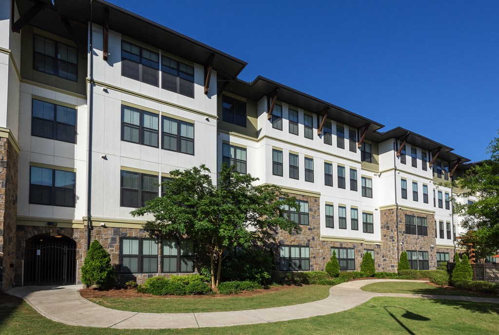 Building Exterior and Green Space at 4700 Colonnade Apartments in Birmingham, AL