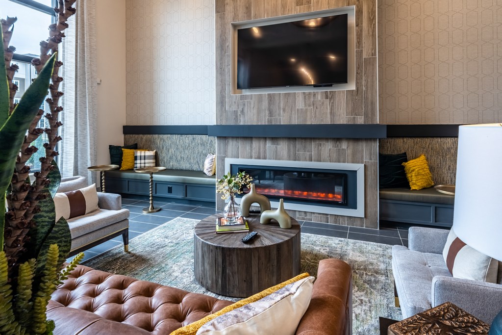 a living room with a fireplace and a television