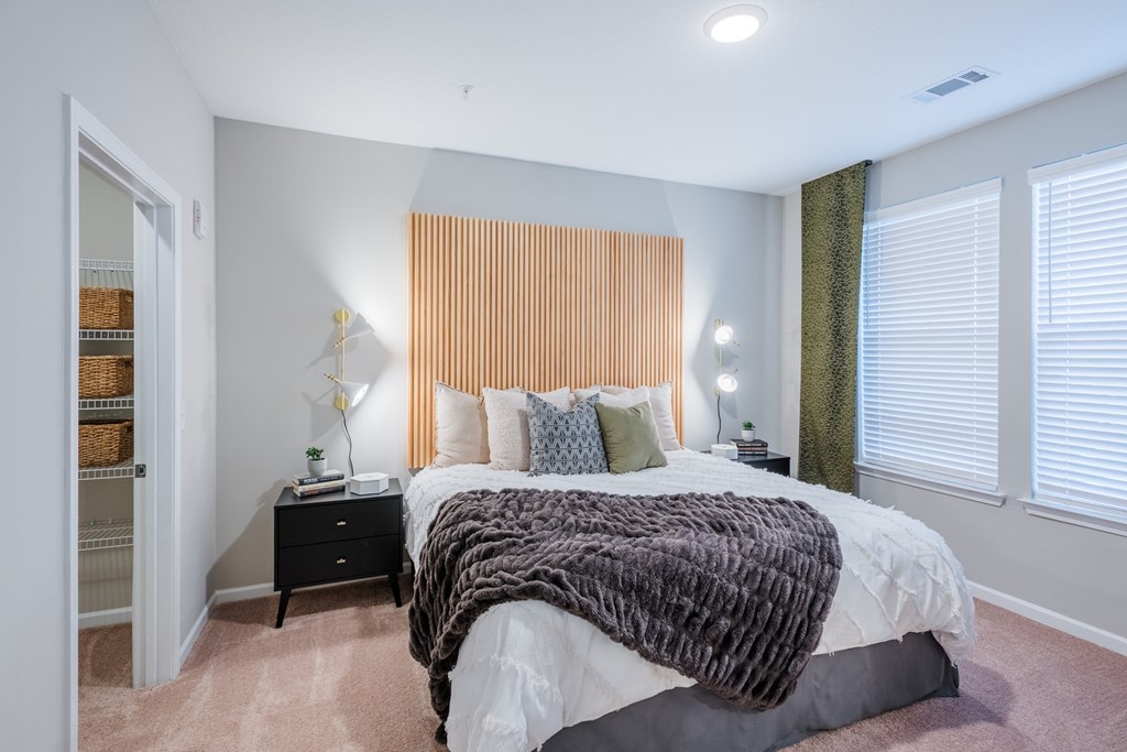 Large bedrooms with plush carpet and big windows at Bon Haven Apartments in Spartanburg, SC