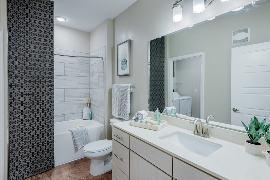 Modern Bathroom with Wood floors and quartz countertops at Bon Haven Apartments in Spartanburg, SC