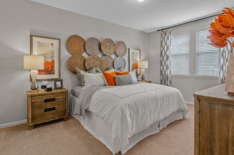 a bedroom with a bed and nightstand
